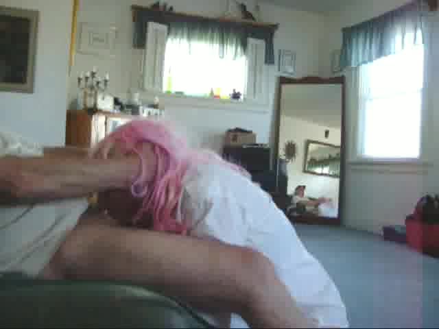 Pink hair crossdresser gives a bj